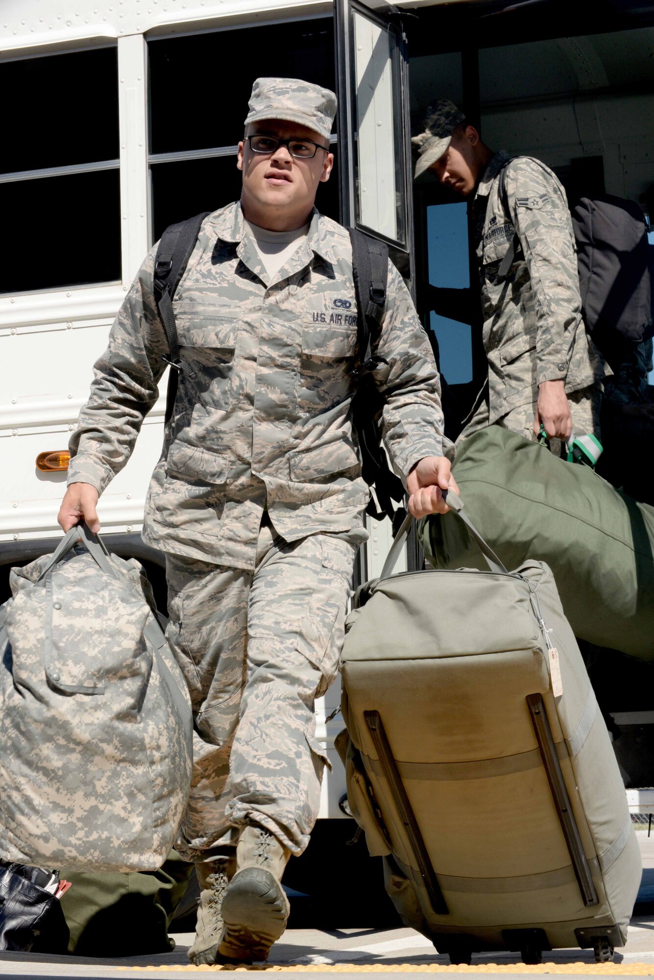 Senior Airman Justin, 28th Munitions Squadron conventional maintenance crew chief, unloads luggage at the Deployment Center, Ellsworth Air Force Base, S.D., July 24, 2015. Justin is one of more than 350 Airmen deploying to Southwest Asia in support of Operation’s Freedom’s Sentinel and Inherent Resolve. (U.S. Air Force photo by Senior Airman Rebecca Imwalle/Released)

