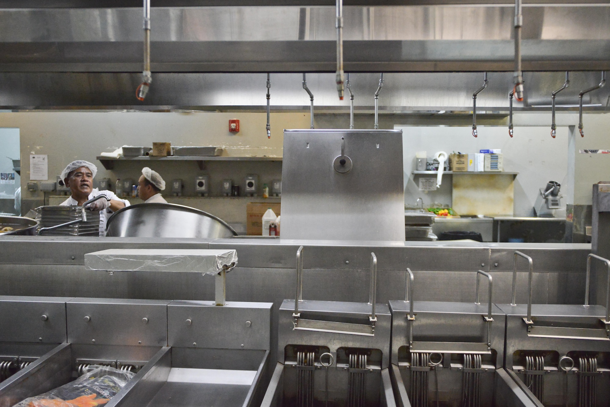 Dining facility cooks prepare and cook ingredients hours prior to lunch time to ensure products served to deployed members are fresh and readily available at the Independence Dining Facility at Al Udeid Air Base, Qatar July 21, 2015. (U.S. Air Force photo/Staff Sgt. Alexandre Montes)  