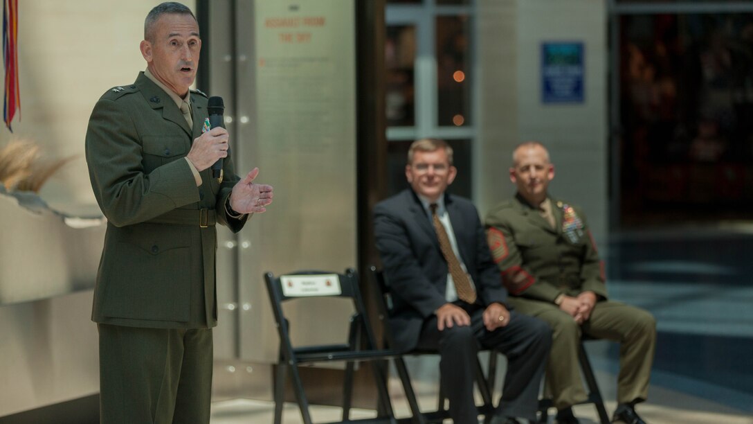 Major Gen. James Lukeman, the commanding general of Training and Education Command, presents Mark Noah, the executive director of History Flight, with the title of Honorary Marine during a ceremony held at the National Marine Corps Museum, at Triangle, Virginia, July 24. Awarding the title of Honorary Marine began in 1992 to recognize individuals, living or deceased, in the civilian community, who have made a contribution the United States Marine Corps.