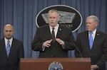 Deputy Defense Secretary Bob Work, center, Undersecretary of Defense for acquisition, technology and logistics Frank Kendall, right, and Dr. Vahid Majidi, chairman of the Comprehensive Review Committee, brief the media on the DoD Comprehensive Anthrax Lab Review findings during a news conference at the Pentagon, July 23, 2015. (DoD photo by Glenn Fawcett) 