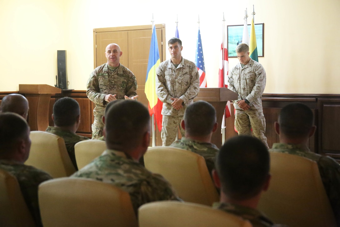 U.S. Marine Sgt. Lloyd, with 2nd Battalion, 8th Marine Regiment, Black Sea Rotational Force, kicks off the noncommissioned officer development seminar at Vaziani Training Area, July 24. Following the two-week Exercise Agile Spirit, 27 Georgian soldiers and 13 U.S. Marines with Black Sea Rotational Force participated in the military-to-military engagement. (U.S. Marine Corps photo by 1st Lt. Sarah E. Burns)