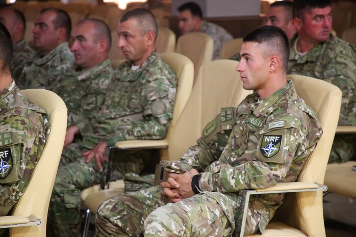 A Georgian soldier listens to U.S. Marines with Black Sea Rotational Force discuss the warrior mentality at the noncommissioned officer development seminar at Vaziani Training Area, July 24. Following the two-week Exercise Agile Spirit, 27 Georgian soldiers and 13 U.S. Marines participated in the military-to-military engagement. (U.S. Marine Corps photo by 1st Lt. Sarah E. Burns)
