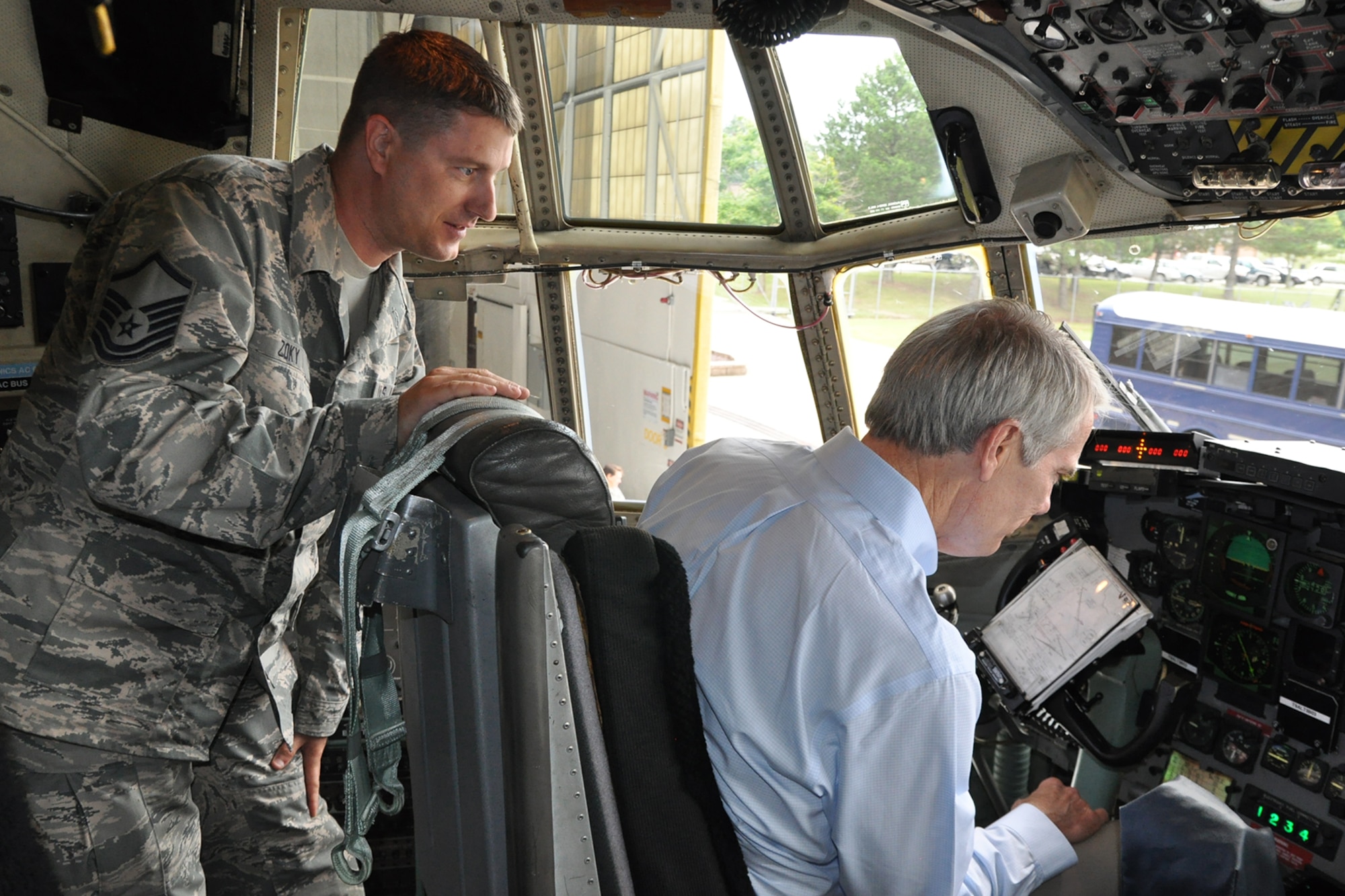 Air Force Reserve Master Sgt. John Zoky, a crew chief assigned to the 910th Aircraft Maintenance Squadron, points out avionics instruments to Ohio U.S. Senator Rob Portman, seated in the pilot’s chair, on the flight deck of one of the 910th Airlift Wing’s C-130H cargo aircraft during the senator’s visit here, July 17, 2015. Portman’s office requested the visit to meet with YARS leadership and get an up close view of installation assets and the unit’s equipment including the wing’s aircraft which are used to conduct airlift/airdrop operations and act as a platform for the Department of Defense’s only large-area, fixed wing aerial spray capability. (U.S. Air Force photo/Master Sgt. Bob Barko Jr.)