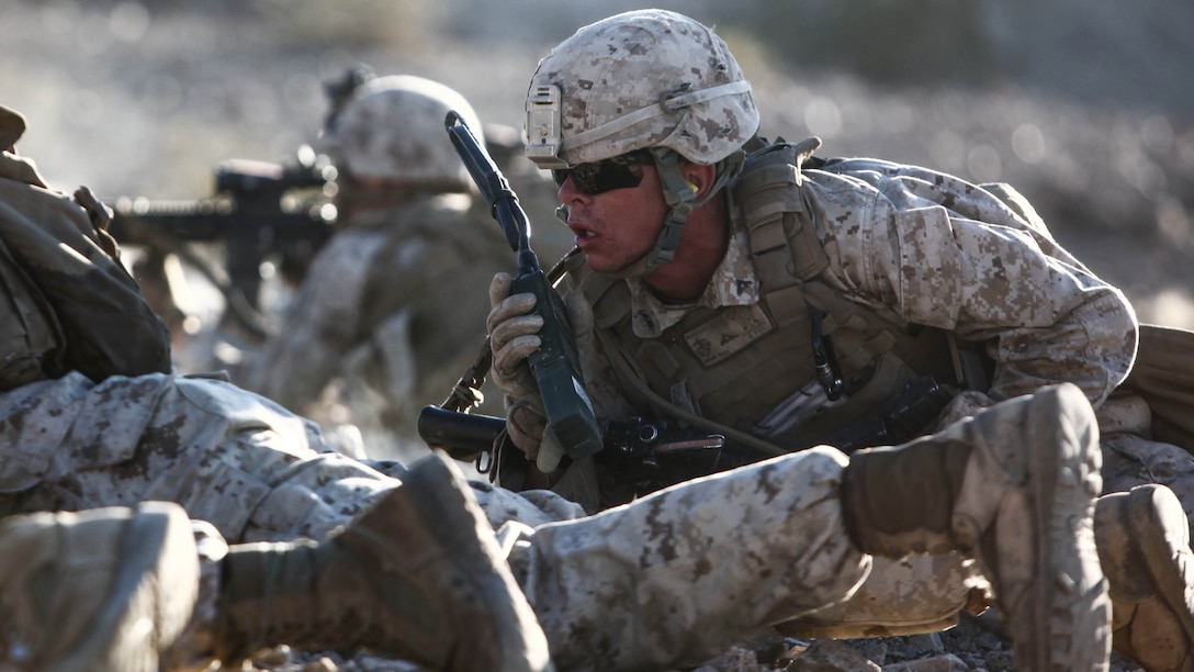 Lance Cpl. Steven Hoggand, a machine gunner and section leader with 1st Platoon, Company C, 1st Battalion, 7th Marines, directs his Marines’ fire while suppressing an enemy position during platoon attack drills, July 24, aboard Marine Corps Air Ground Combat Center Twentynine Palms, Calif. Training began for the Marines of Company C with a combined arms fire and maneuver exercise as part of their Integrated Training Exercise in preparation for their upcoming deployment with Special Purpose Marine Air Ground Task Force Crisis Response Central Command 16.1 scheduled to depart later this year.