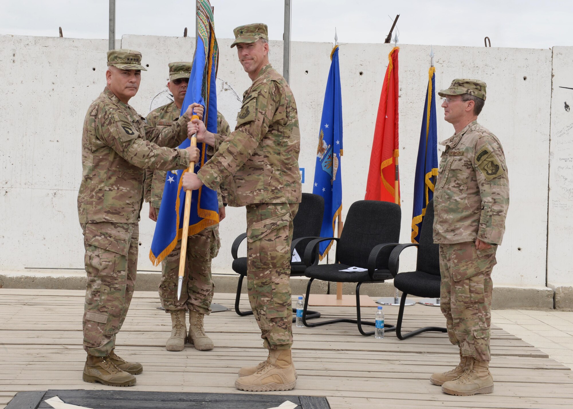 Brig. Gen. Christopher E. Craige takes command of the Train, Advise, Assist Command – Air (TAAC-Air), 438th Air Expeditionary Wing during a ceremony  July 27, 2015, at Hamid Karzai International Airport, Kabul, Afghanistan. Presiding at the ceremony was Gen. John F. Campbell, commander, Resolute Support and U.S. Forces-Afghanistan. (U.S. Air Force photo by Senior Airman Cierra Presentado/Released)