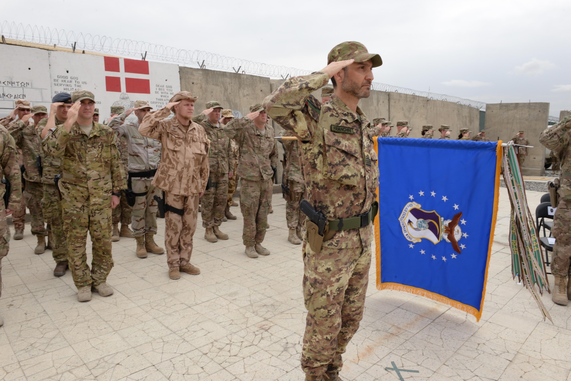 Train, Advise, Assist Command-Air (TAAC-Air) Italian Chief of Staff Col. Giovanni Franchini, commands the formation of coalition Airmen during a change of command ceremony July 27, 2015, at Hamid Karzai International Airport, Kabul, Afghanistan. Brig. Gen. Christopher E. Craige took command of  TAAC-Air, 438th Air Expeditionary Wing. Presiding at the ceremony was Gen. John F. Campbell, commander, Resolute Support and United States Forces-Afghanistan. (U.S. Air Force photo by Senior Airman Cierra Presentado/Released)