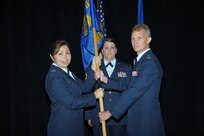 Lt. Col. Patrick Pohle(right) accepts the guidon from Col. Dana James, 359th Medical Group commander, to assume command of the 359th Medical Operations Squadron during the 359th Medical Operation Sq. change of command July 24, 2015 at Joint Base San Antonio-Randolph.  As squadron commander, he will have oversight of 118 personnel and is responsible for the operations of eight outpatient clinics.  Lt. Col Pohle was assigned to the Air Force Inspection Agency's Medical Directorate as a Medical Inspector. (U.S. Air Force photo by Joel Martinez/Released)