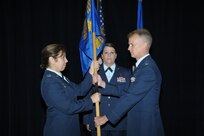 Lt. Col. Patrick Pohle(right) accepts the guidon from Col. Dana James, 359th Medical Group commander, to assume command of the 359th Medical Operations Squadron during the 359th Medical Operation Sq. change of command July 24, 2015 at Joint Base San Antonio-Randolph.  As squadron commander, he will have oversight of 118 personnel and is responsible for the operations of eight outpatient clinics.  Lt. Col Pohle was assigned to the Air Force Inspection Agency's Medical Directorate as a Medical Inspector. (U.S. Air Force photo by Joel Martinez/Released)