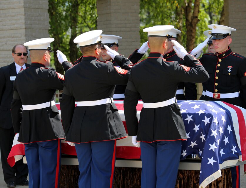 The Marines of Battery M, 3rd Battalion, 14th Marine Regiment salute Staff Sgt. David A. Wyatt, who was a field artillery operations man with Battery M. Wyatt was laid to rest at the Chattanooga National Cemetery, July 24, 2015. Wyatt is one of five service members who died when a gunman attacked the Naval Operational Support Center and Marine Corps Reserve Center on July 16, 2015. Family and community members joined the Marines to pay their respects and thank Wyatt for his service to this country.