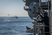 160415-N-MD297-038 PACIFIC OCEAN (April 16, 2015) – Master-at-Arms 2nd Class Roderick Payne aims a Long Rang Acoustic Device (LRAD) at an incoming small craft during a Straits Transit exercise aboard Wasp-class amphibious assault ship USS Essex (LHD 2). Essex is underway participating in a certification exercise (CERTEX) with the Essex Amphibious Ready Group (ARG), which is comprised of amphibious Squadron (PHIBRON) THREE and 15th Marine Expeditionary Unit (MEU). (U.S. Navy photo by Mass Communication Specialist 3rd Class Huey D. Younger Jr./Released)