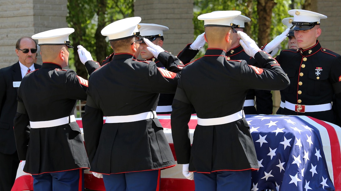 The Marines of Battery M, 3rd Battalion, 14th Marine Regiment salute Staff Sgt. David A. Wyatt, who was a field artillery operations man with Battery M. Wyatt was laid to rest at the Chattanooga National Cemetery, July 24, 2015. Wyatt is one of five service members who died when a gunman attacked the Naval Operational Support Center and Marine Corps Reserve Center on July 16, 2015. Family and community members joined the Marines to pay their respects and thank Wyatt for his service to this country.