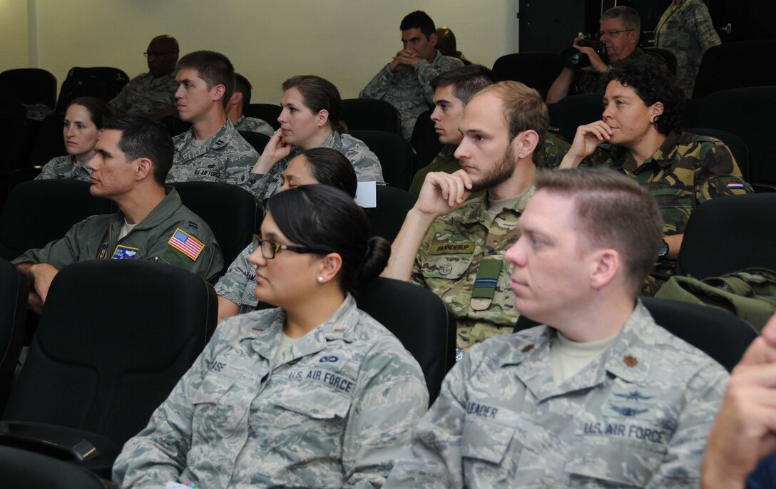 Second Lt. Ashley Klase, Ohio Air National Guard, and Maj. Jeremy Leader, an Air Force reservist assigned to Joint Base Langley-Eustis, Virginia, listen to Maj. Gen. Mark Loeben's presentation about U.S. European Command July 21.  They participated in the International Junior Officer Development Seminar, hosted by Air Force Reserve Command at Ramstein Air Base, Germany, from July 18-25, 2015. Forty-six officers from seven nations participated in this year's IJOLDS. (U.S. Air Force photo/Col. Rob Palmer)
