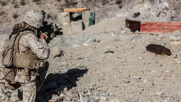 Lance Cpl. Randy Dick, a rifleman with 1st Platoon, Company C, 1st Battalion, 7th Marines, fires on an enemy machine gun bunker during platoon attack drills, July 24, aboard Marine Corps Air Ground Combat Center Twentynine Palms, Calif. Training began for the Marines of Company C with a combined arms fire and maneuver exercise as part of their Integrated Training Exercise in preparation for their upcoming deployment with Special Purpose Marine Air Ground Task Force Crisis Response Central Command 16.1 scheduled to depart later this year.