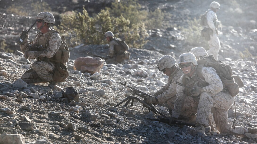 A medium machine gun team with 1st Platoon, Company C, 1st Battalion, 7th Marines, prepares to advance to their support by fire position during platoon attack drills, July 24, aboard Marine Corps Air Ground Combat Center Twentynine Palms, Calif. Training began for the Marines of Company C with a combined arms fire and maneuver exercise as part of their Integrated Training Exercise in preparation for their upcoming deployment with Special Purpose Marine Air Ground Task Force Crisis Response Central Command 16.1 scheduled to depart later this year.