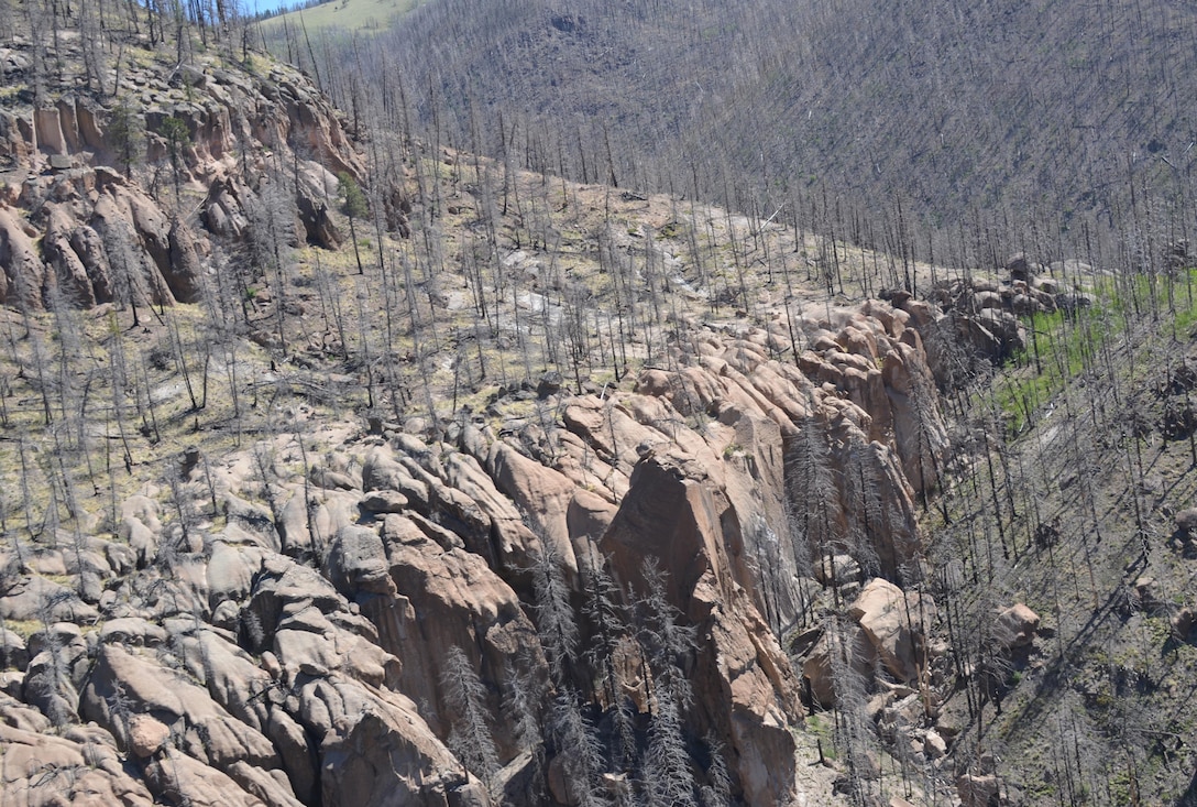 As Climate Changes, Santa Clara Strives To Become Resilient To Worsening Fires, Floods: Part of the Las Conchas Fire burn scar in the Santa Clara Canyon area, as viewed from from a helicopter tour on June 4. Courtesy Elizabeth Lockyear/U.S. Army Corps of Engineers, Albuquerque District