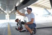 Mac Capistran, 12th Flying Training Wing maintenance mechanic, prepares to fuel a T-38 aircraft July 27, 2015 at Joint Base San Antonio-Randolph.  The Maintenance Directorate preforms launch/recovery and off/on equipment maintenance for T-1A, T-6A, T-38C and T-38 aircraft valued at more than $760 million.(U.S. Air Force photo by Joel Martinez/Released)