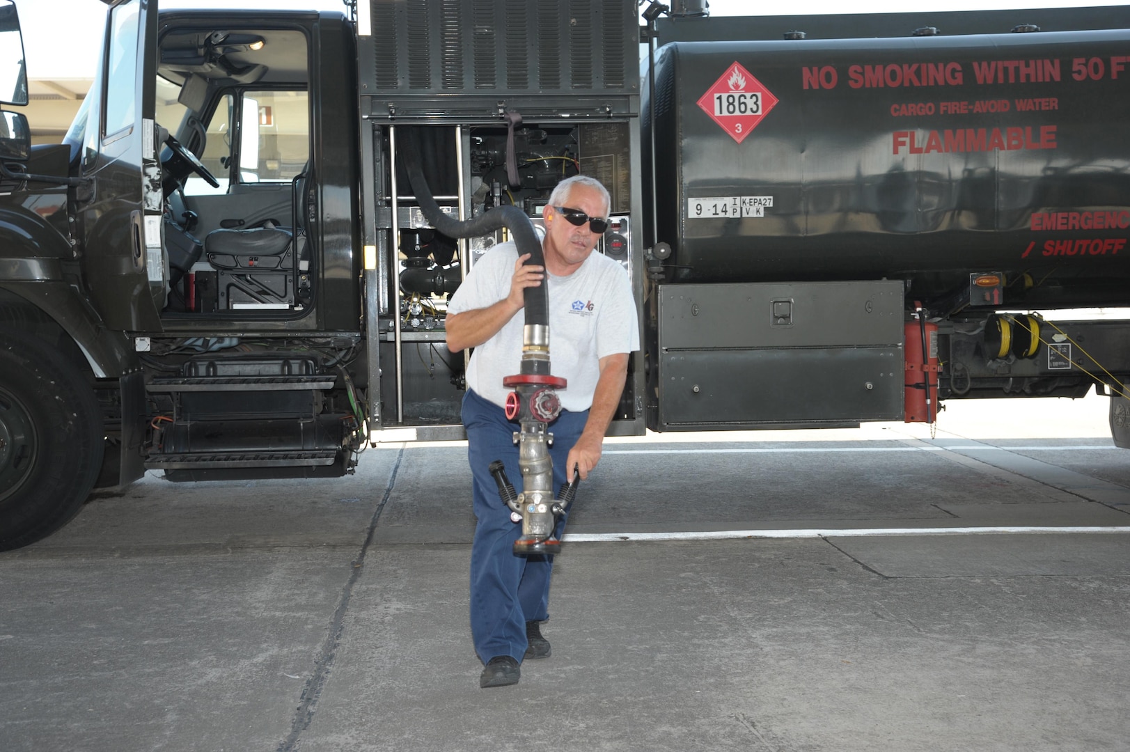 John Sistrunk, Defense Contract Services, Incorporated International Logistics Group refueler, prepares to refuel a T-38 aircraft July 27, 2015 at Joint Base San Antonio-Randolph. (U.S. Air Force photo by Joel Martinez/Released)