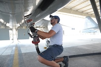 Mac Capistran, 12th Flying Training Wing maintenance mechanic, prepares to fuel a T-38 aircraft July 27, 2015 at Joint Base San Antonio-Randolph.  The Maintenance Directorate preforms launch/recovery and off/on equipment maintenance for T-1A, T-6A, T-38C and T-38 aircraft valued at more than $760 million.(U.S. Air Force photo by Joel Martinez/Released)