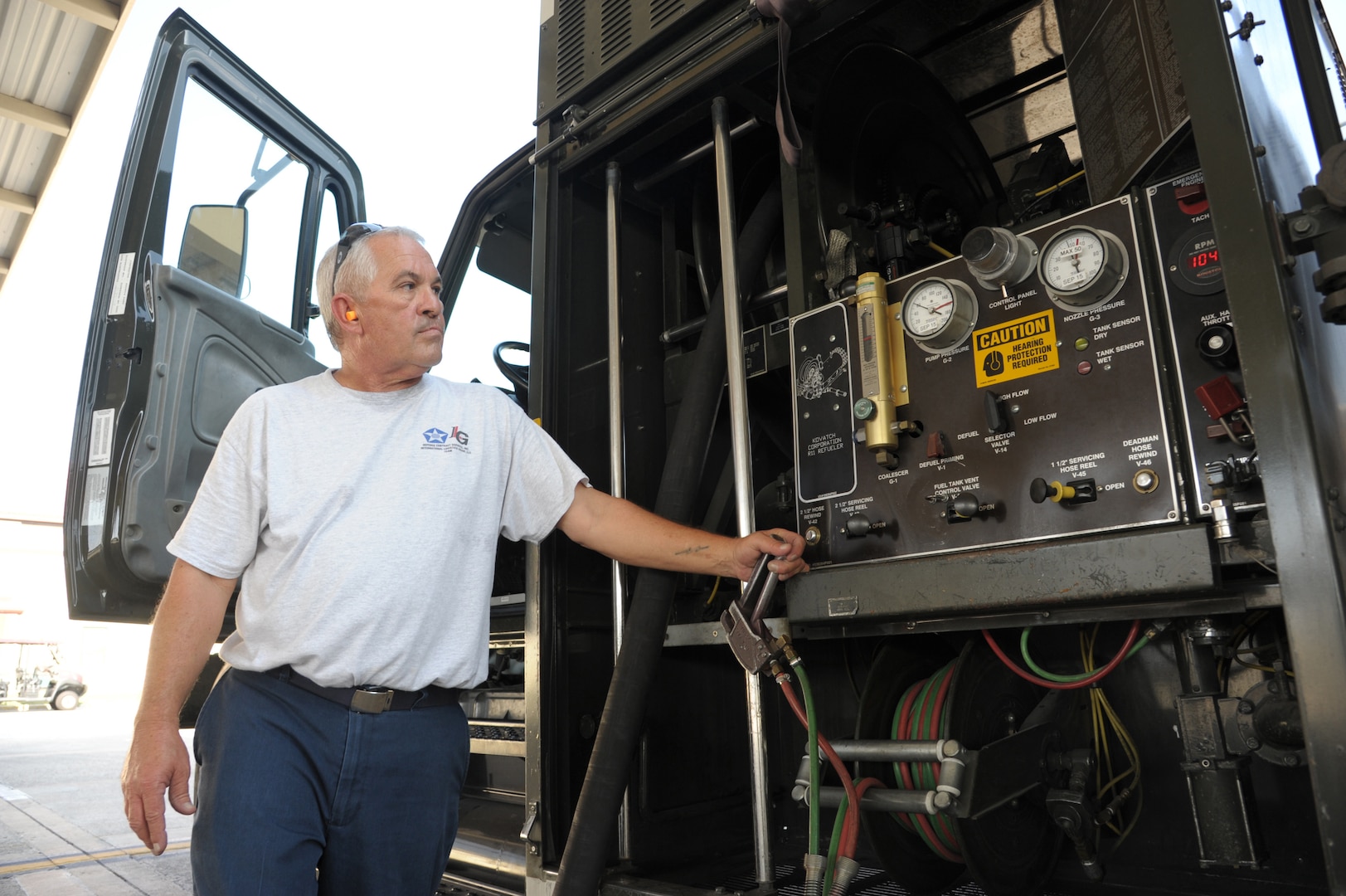 John Sistrunk, Defense Contract Services, Incorporated International Logistics Group refueler, monitors the fuel gages on his vehicle while refueling a T-38 aircraft, July 27 at Joint Base San Antonio-Randolph. (U.S. Air Force photo by Joel Martinez/Released)