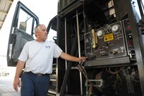 John Sistrunk, Defense Contract Services, Incorporated International Logistics Group refueler, monitors the fuel gages on his vehicle while refueling a T-38 aircraft, July 27 at Joint Base San Antonio-Randolph. (U.S. Air Force photo by Joel Martinez/Released)