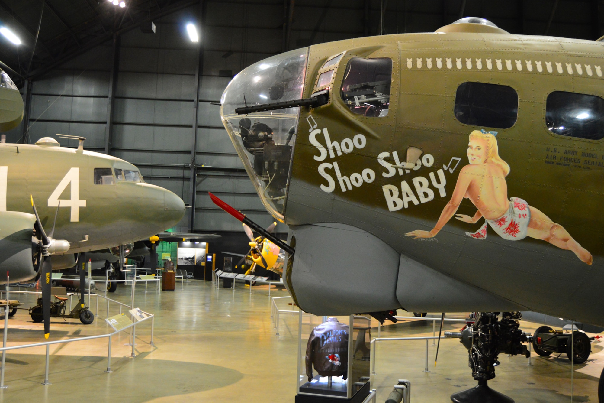 DAYTON, Ohio -- Boeing B-17G Flying Fortress "Shoo Shoo Shoo Baby" (right) and the Douglas C-47D Skytrain (left) in the World War II Gallery at the National Museum of the United States Air Force. (U.S. Air Force photo)