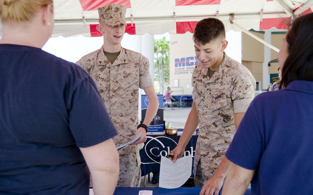 Lance Corporals Jeffrey Sickmeier (left), and Steven Williams, both legal clerks with the Legal Services Center, Marine Corps Base Hawaii, visit resource tables during the Education Expo at Mokapu Mall, July 23, 2015. More than 180 attendees visited more than 20 resource tables, many featuring colleges and universities, at Mokapu Mall to share information with the Marines and Sailors of MCB Hawaii about Marine Corps Community Services, education opportunities and more. In addition, Marines were given the opportunity to receive credit for the College 101 Education Brief by attending the expo, provided they met certain requirements, such as correctly completing a series of written questions at the Education Center tent and visiting at least five schools during the expo. The questions included information about tuition assistance policy and procedure. The College 101 Education Brief is held Wednesdays from 11:30 a.m. to 12:30 p.m. at the Education Center. Per Marine Corps Order 1560.25, Marines must attend the brief to be eligible for TA. The mission of Marine Corps Base Hawaii provides facilities, programs and services in direct support of units, individuals and families in order to enhance and sustain combat readiness for all operating forces and tenant organizations aboard the installation. (U.S. Marine Corps photo by Kristen Wong/Released)