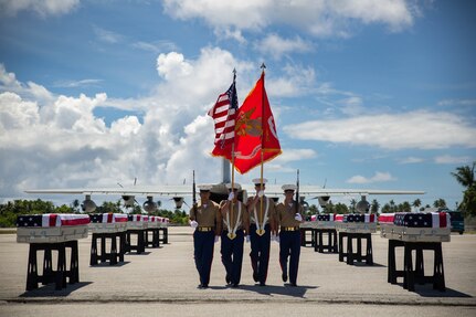 TARAWA, Kiribati (July 25, 2015) - A 3rd Marine Regiment color guard takes its place during a repatriation ceremony.  The ceremony honored the remains of approximately 36 Marines who fought and died during the Battle of Tarawa during World War II, and were loaded onto a C-130J Hercules aircraft to be transported back home to the United States. 