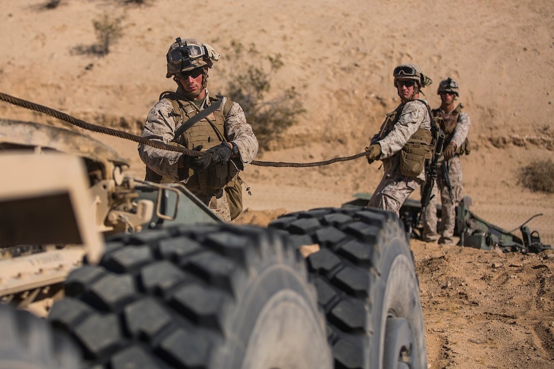 U.S. Marines with 2nd platoon, Transportation Support Company, Combat Logistics Battalion 1, conduct vehicle recovery lane training during an Integrated Training Exercise aboard Marine Corps Air Ground Combat Center Twentynine Palms, Calif., July 21, 2015. ITX is conducted to enhance the integration and warfighting capability from all elements of the Marine Air Ground Task Force. CLB-1 is currently training to support Special Purpose Marine Air Ground Task Force Crisis Response Central Command 16.1. (U.S. Marine Corps photo by Lance Cpl. Clarence A. Leake/Released)