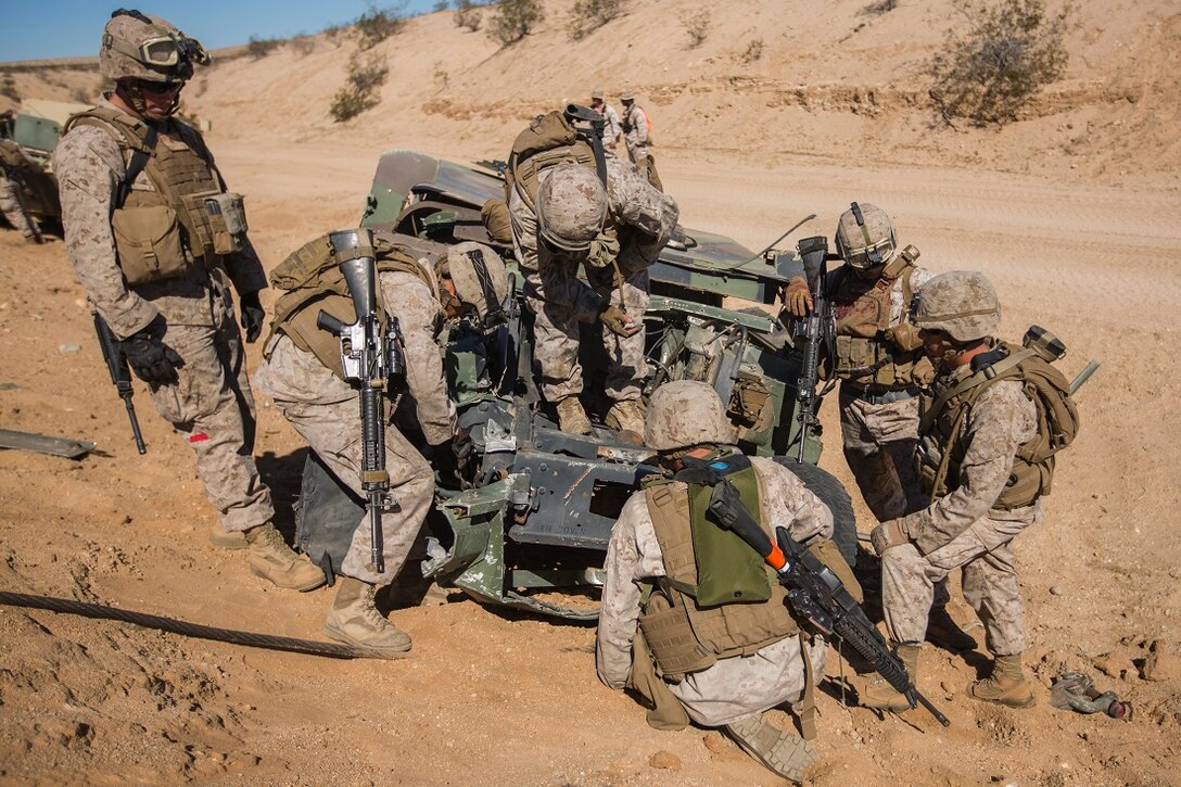 U.S. Marines with 2nd platoon, Transportation Support Company, Combat Logistics Battalion 1, conduct vehicle recovery lane training during an Integrated Training Exercise aboard Marine Corps Air Ground Combat Center Twentynine Palms, Calif., July 21, 2015. ITX is conducted to enhance the integration and warfighting capability from all elements of the Marine Air Ground Task Force. CLB-1 is currently training to support Special Purpose Marine Air Ground Task Force Crisis Response Central Command 16.1. (U.S. Marine Corps photo by Lance Cpl. Clarence A. Leake/Released)