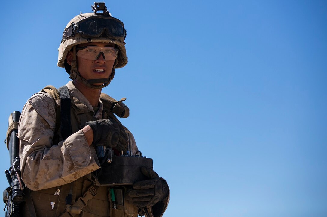 U.S. Marine Corps Cpl. Lucas Javier with 2nd platoon, Transportation Support Company, Combat Logistics Battalion 1, controls a winch to extract a Humvee from a rig while conducting vehicle recovery lane training during an Integrated Training Exercise aboard Marine Corps Air Ground Combat Center Twentynine Palms, Calif., July 21, 2015. ITX is conducted to enhance the integration and warfighting capability from all elements of the Marine Air Ground Task Force. CLB-1 is currently training to support Special Purpose Marine Air Ground Task Force Crisis Response Central Command 16.1. (U.S. Marine Corps photo by Lance Cpl. Clarence A. Leake/Released)