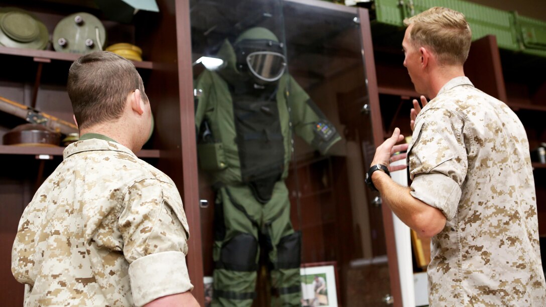 James Gallant, a young man diagnosed with brain cancer, tours the Explosive Ordnance Disposal library with Marines of 1st EOD Company, 1st Marine Logistics Group, aboard Camp Pendleton, Calif., July 25, 2015. Collaborating with the Make-A-Wish Foundation, 1st EOD helped James experience what being an EOD technician is like by giving him a tour through their library of ordnance and EOD tools, teaching him to operate the TALON bomb disposing robot and presenting him with his own desert utilities and EOD badge.