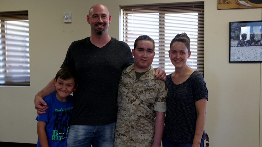 James Gallant, a young man diagnosed with brain cancer, poses for a photo with his family aboard Camp Pendleton, Calif., July 25, 2015. Collaborating with the Make-A-Wish Foundation, 1st Explosive Ordnance Disposal Company, 1st Marine Logistics Group, helped James experience what being an EOD technician is like by giving him a tour through their library of ordnance and EOD tools, teaching him to operate the TALON bomb disposing robot and presenting him with his own desert utilities and EOD badge.