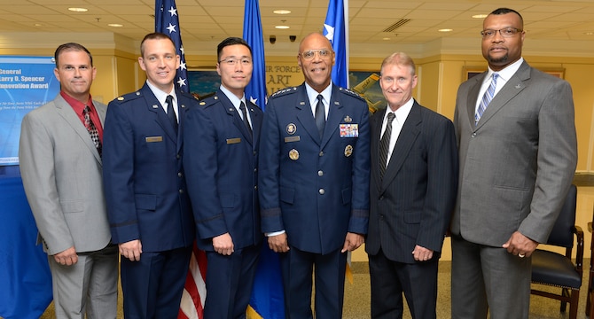 The 2014 individual and team winners of the inaugural General Larry O. Spencer Innovation Award stand with Spencer, the Air Force vice chief of staff, after a ceremony at the Pentagon July 23, 2015. They are, from left to right, Andrew L. Sloper, Maj. Perry J. Johns, Maj. Anthony Ty, Spencer, Frederick Suedbeck and Anthony McCray.  The award was created by Air Force Chief of Staff Gen. Mark A. Welsh III to recognize Airmen who share their creative and efficient ways to save money and time. (U.S. Air Force photo/Scott M. Ash)