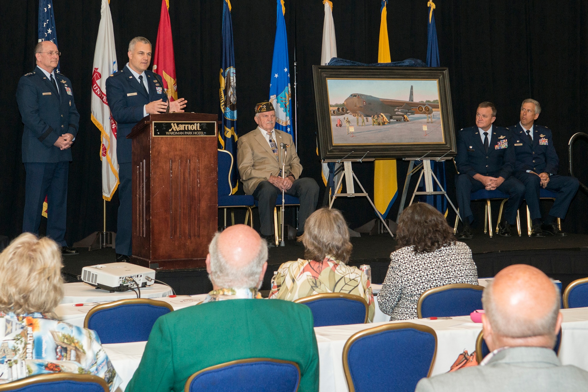 Maj. Warren Neary, an Air Force Reserve Historian and artist addresses the audience during the Reserve Officers Association National Convention in Washington D.C. Jul. 27, 2015.  Neary, an award-winning artist who was recently selected as the 2015 Air Force Association National Aerospace Gill Robb Wilson Award for Arts and Letters, participated in an unveiling of his painting "Deterrence on Demand" that will be entered in to the Air Force Art Program. (U.S. Air Force photo by Master Sgt. Gregory Steele)  

