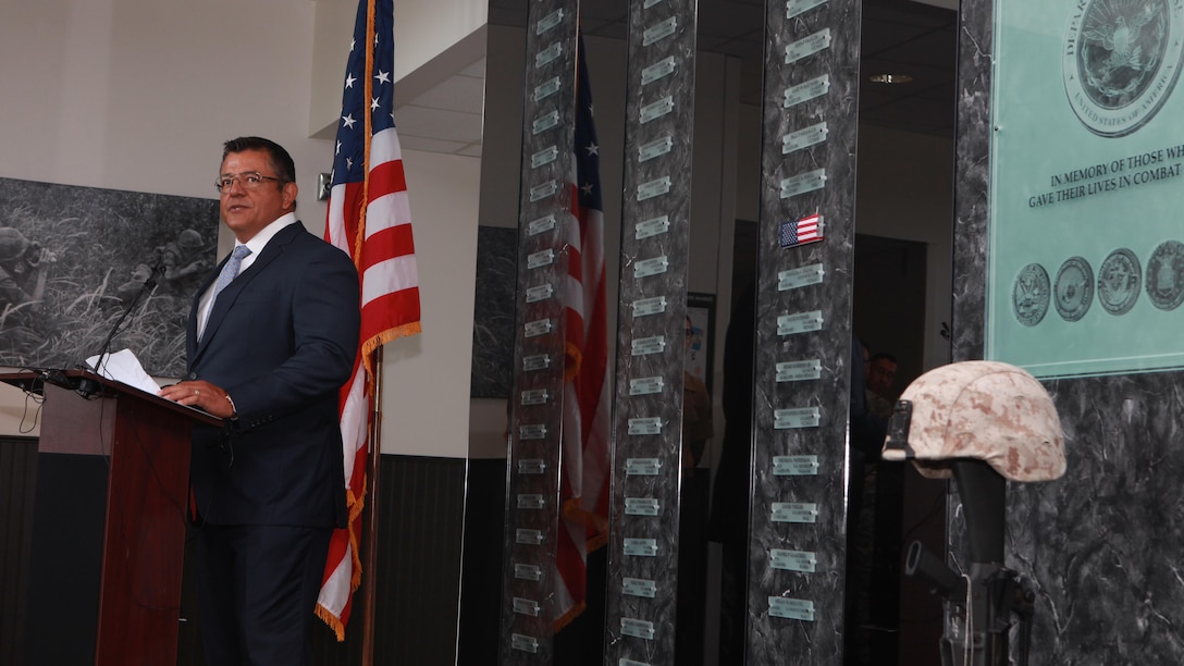 Michael Lujan, a retired Marine and director of Combat Camera at Marine Corps Base Quantico, Virginia, gives a eulogy for Cpl. Sara Medina July 27, 2015, at the Defense Information School at Fort George G. Meade, Md. Medina, along with Lance Cpl. Jacob Hug, had their names mounted to the Hall of Heroes display at DINFOS honoring their service after losing their lives in a helicopter crash during relief efforts in Nepal. 
