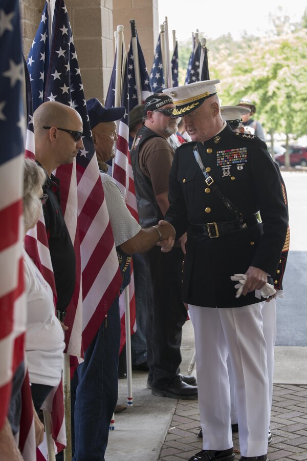 Lt. Gen. Richard P. Mills, commander of Marine Forces Reserve, greets veterans and civilians attending Lance Cpl. Squire “Skip” Wells’ funeral at the First Baptist Church of Woodstock, Ga. July 26, 2015. Wells was one of five service members killed during a shooting at the Naval Operational Support Center and Marine Corps Reserve Center on July 16, 2015. Hundreds of people were present at the service showing their respect and support for Wells, his family and friends. (U.S Marine Corps photo by Corporal Ian Ferro)