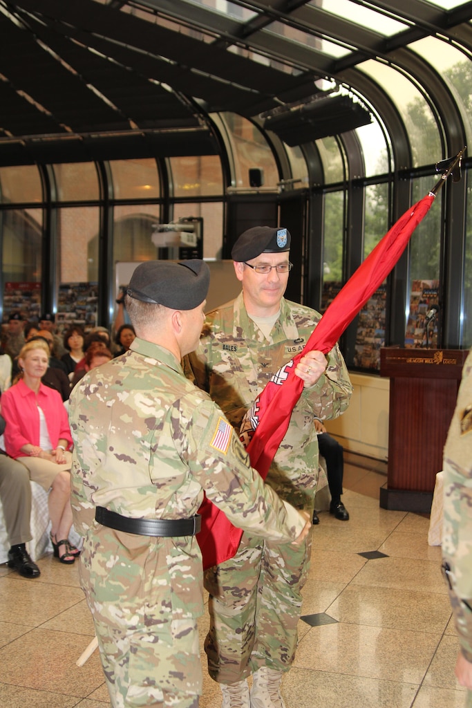 Brig. Gen. Jeffrey L. Milhorn (left), Commander, U.S. Army Corps of Engineers, Pacific Ocean Division, passes the Engineer Colors to Col. Stephen H. Bales (right), Far East District commander, during a change of command ceremony on U.S. Army Garrison Yongsan July 24.
