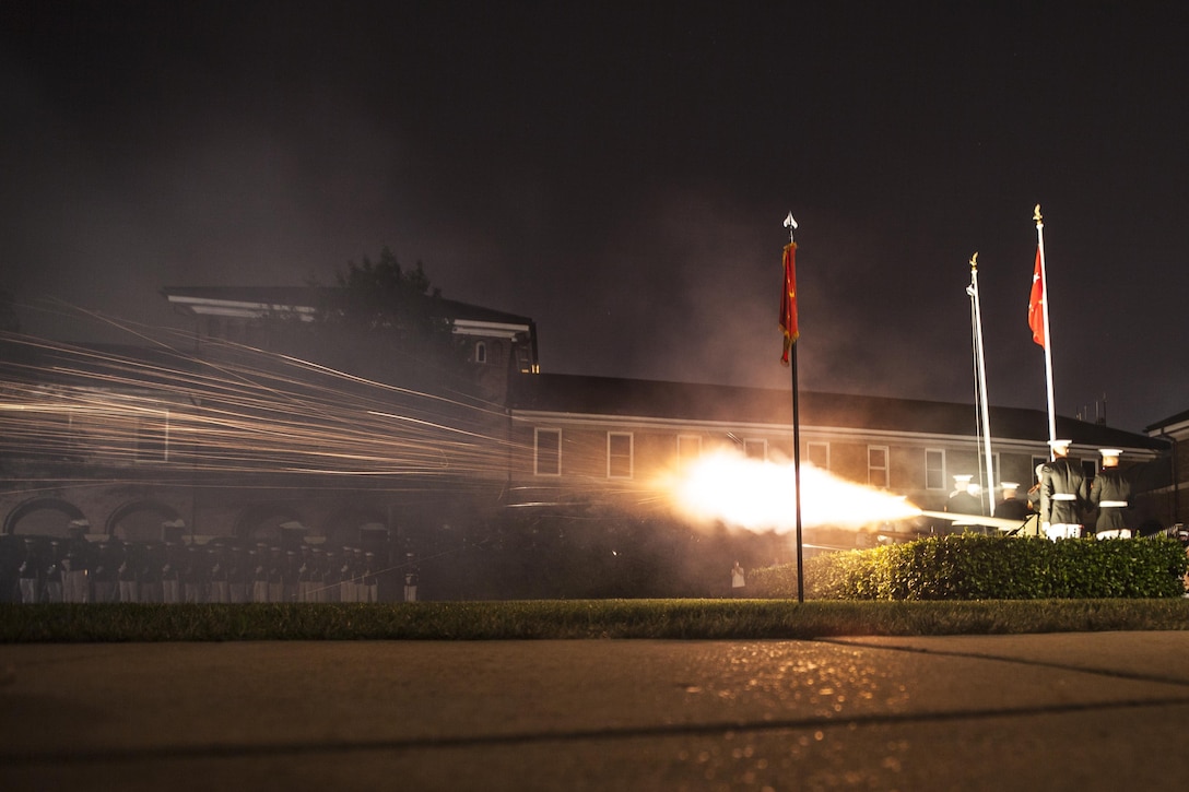 U.S. Marines with Marine Barracks Washington fire the canons during an evening parade in MBW, D.C., July 24, 2015. Gen. Joseph F. Dunford Jr., 36th commandant of the Marine Corps, was the official host and Adm. Jonathan W. Greenert, chief of Naval Operations, was the guest of honor. The Evening Parade summer tradition began in 1934, and features the Silent Drill Platoon, the U.S. Marine Band, the U.S. Marine Drumand Bugle Corps alongside two marching companies. More than 3,500 guests attend the parade every week. 