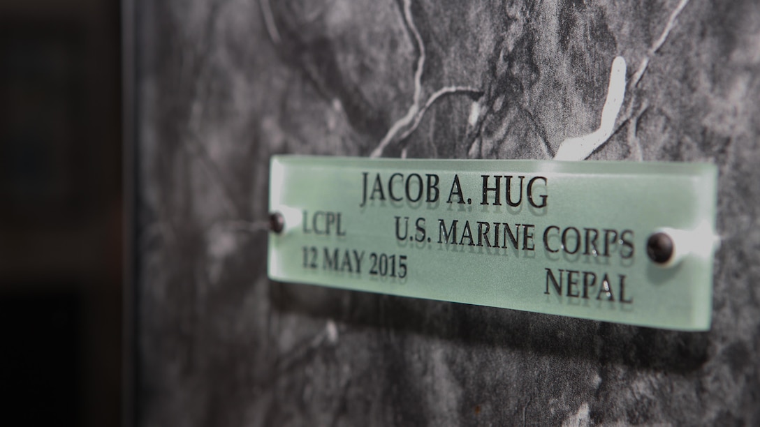 Lance Cpl. Jacob Hug’s name is mounted July 27, 2015, in the Hall of Heroes at the Defense Information School at Fort George G. Meade, Md. Hug, along with Cpl. Sara Medina, had their names mounted to the Hall of Heroes display at DINFOS during a ceremony honoring their service after losing their lives in a helicopter crash during relief efforts in Nepal. 