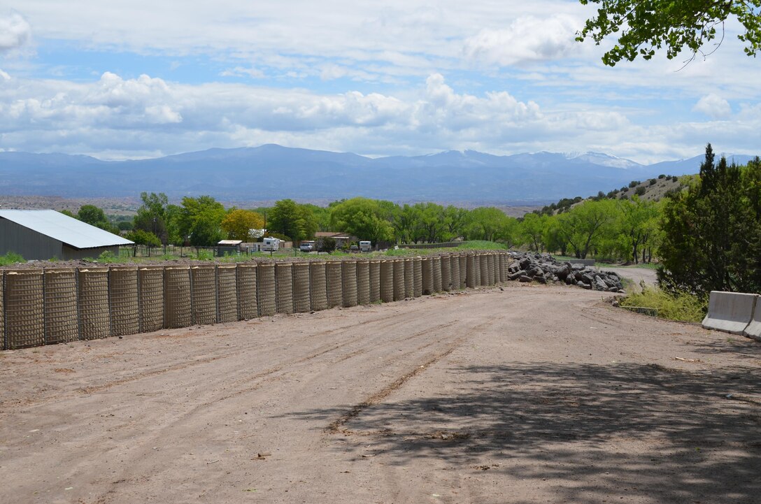 Sediment-filled Hesco baskets line the Santa Clara Creek channel to increase the height of the bank and help contain some flood flows. Courtesy Elizabeth Lockyear/U.S. Army Corps of Engineers, Albuquerque District
