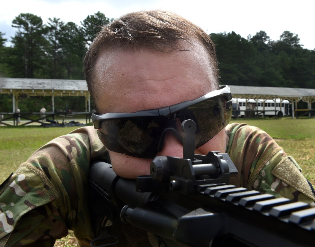 Air Force Senior Airman Thomas Smith participates in the weapons qualification range with the M4 carbine rifle during the 3rd annual U.S. Army Spc. Hilda I. Clayton Best Combat Camera 2015 on Fort Meade, Md., July 14, 2015. Smith is a combat broadcaster assigned to the 3rd Combat Camera Squadron.