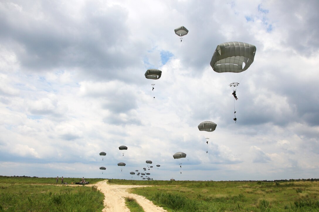 Paratroopers descend toward Salerno drop zone during a mass tactical jump at Fort Bragg, N.C., July 24, 2015.