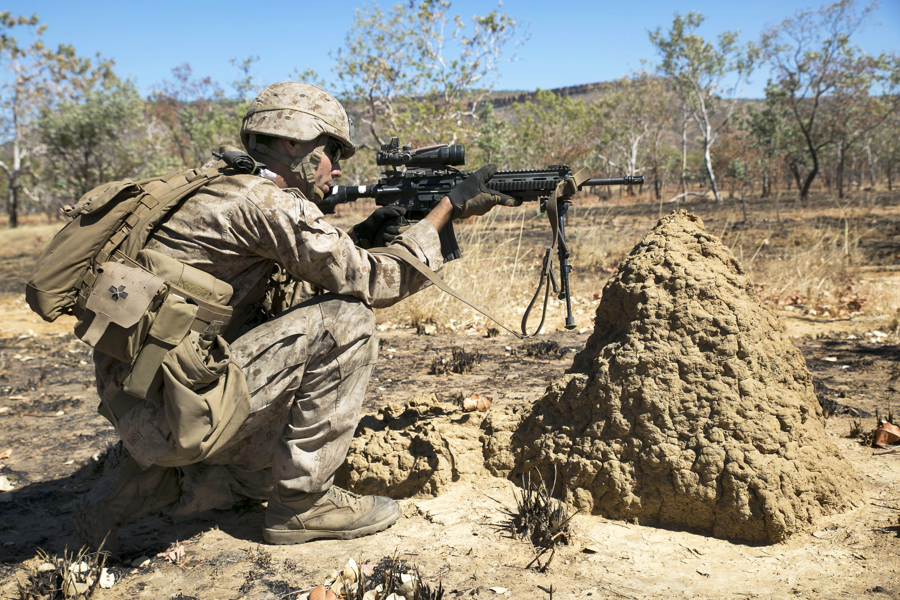 U.S. Marine Lance Cpl. Sephen Hardy takes cover during livefire training as part of Talisman