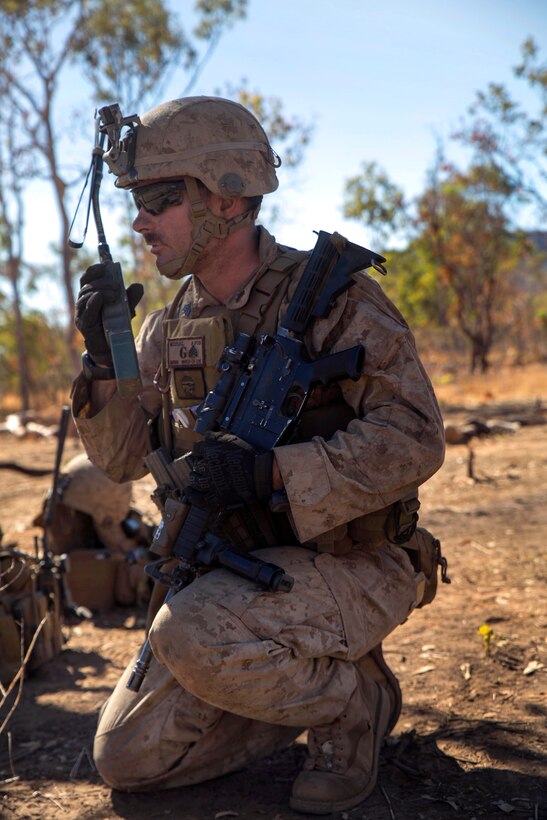 U.S. Marine Corps Lance Cpl. Sgt. Casey McCoy coordinates fires before a live-fire exercise during Talisman Sabre 2015 at Bradshaw Field Training Area, Australia, July 18, 2015. McCoy is assigned to Golf Company, Battlalion Landing Team 2nd Battalion, 5th Marines, 31st Marine Expeditionary Unit.
