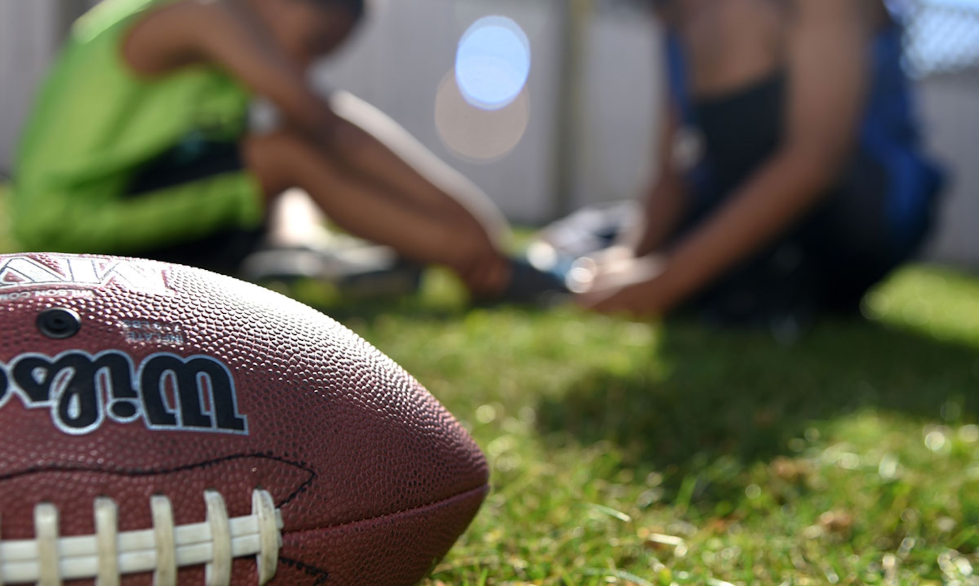 Summer is one of the most dangerous seasons for sports injuries. Children and adults should properly prepare for and ease into summer sports such as football to prevent injuries. Summer sports safety can be narrowed down to three essentials points: hydration, stretching and conditioning, and the wear of proper gear. (U.S. Air Force photo/Staff Sgt. Sheila deVera)