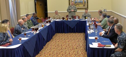 Col. Robert Lyman, Joint Base Charleston commander (standing), conducts his first Big 10 Mission Partners Senior Leadership luncheon, July 23, 2015 at Joint Base Charleston - Weapons Station, S.C. The luncheon provides leadership the opportunity to discuss various topics, give unit updates and build unit cohesiveness. (U.S. Air Force photo/Seamus O’Boyle)