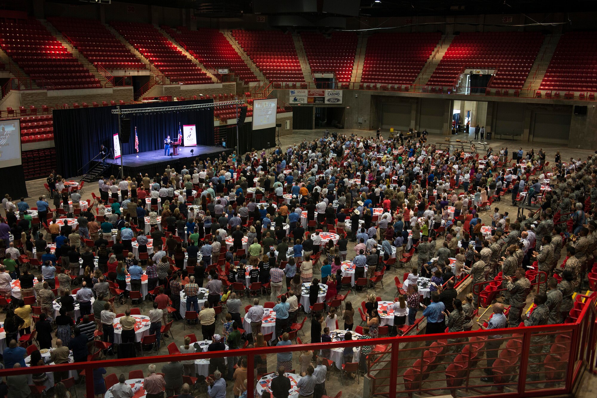U.S. Air Force Airmen, in attendance with the Wichita Falls community, listen to Medal of Honor recipient retired U.S. Army Master Sgt. Leroy Petry, retired U.S. Army Sgt. 1st Class Dana Bowman and retired U.S. Army Staff Sgt. Shilo Harris speak during the Wichita Falls Leadership Breakfast at the Kay Yeager Coliseum in Wichita Falls, Texas, July 24, 2015. Each of the speakers shared their stories of resiliency and courage with hopes to inspire people to do what is right and overcome their own challenges. (U.S. Air Force photo by Senior Airman Kyle Gese/Released)