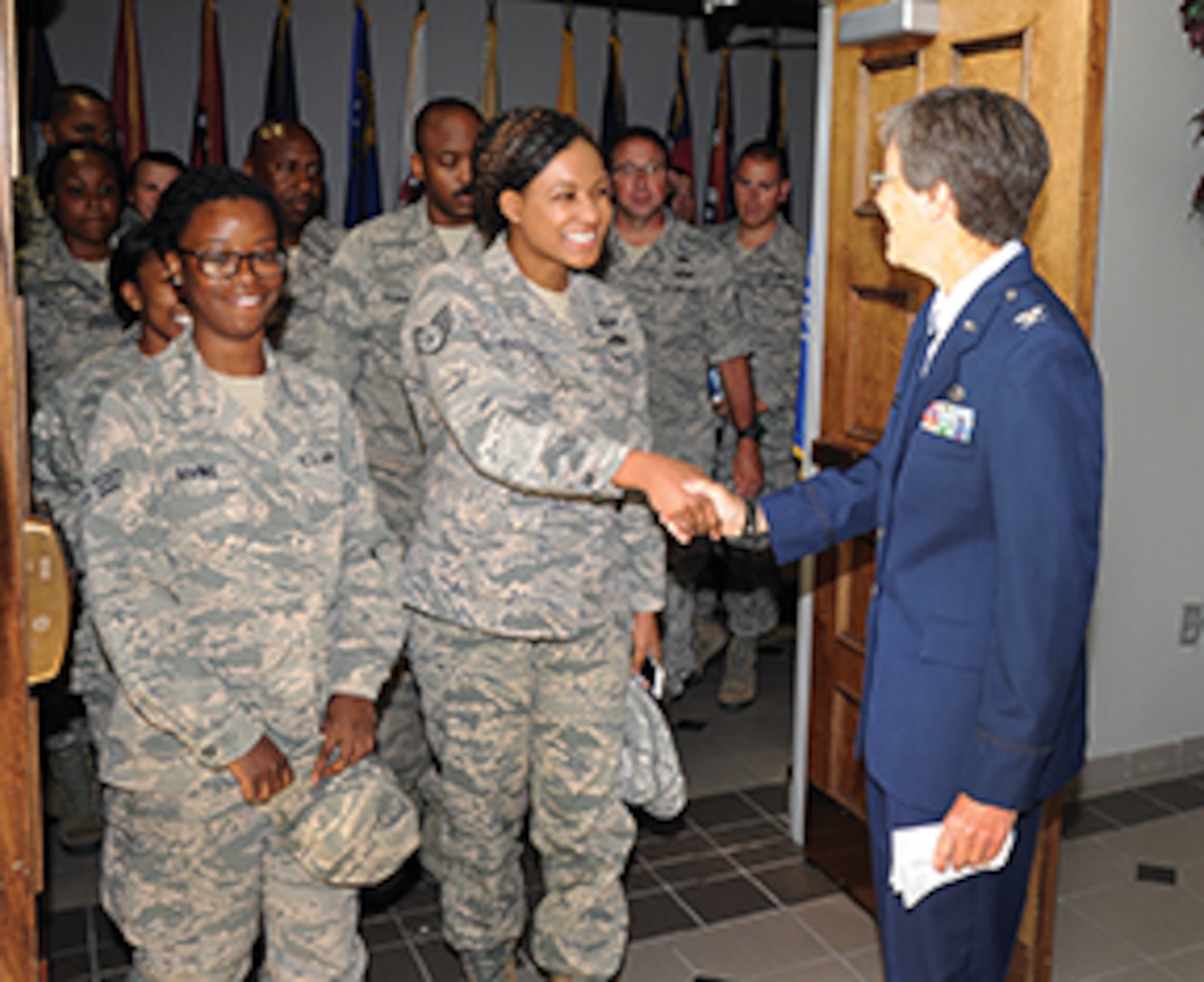 Colonel Patricia Brewer, new commander of the 908th Mission Support Group, greets Airmen of her new command following her assumption ceremony. 
