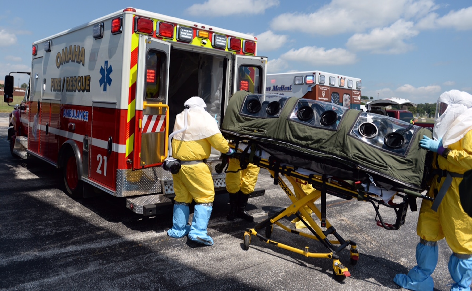 Members of the Omaha Fire and Rescue Department load a simulated patient into an ambulance during exercise PATRIOT 15, at Offutt Air Force Base, Nebraska. July 23, 2015. PATRIOT is a Domestic Operation disaster-response training exercise conducted by National Guard units working with federal, state and local emergency management agencies and first responders. (U.S. Air Force photo by Tech. Sgt. Nathan Lipscomb)