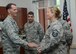 Master Sgt. Carissa M. Correll, 131st Logistics Readiness Squadron, receives a coin from Director of the Air National Guard Lt. Gen. Stanley E. Clarke III during his visit to Jefferson Barracks, Missouri, on July 21, 2015. Lt. Gen. Clarke awarded coins to Citizen-Airmen for their superior performance. (U.S. Air National Guard photo by Staff Sgt. Brittany Cannon)